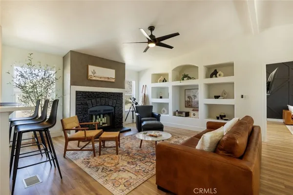 a living room with furniture and a fireplace
