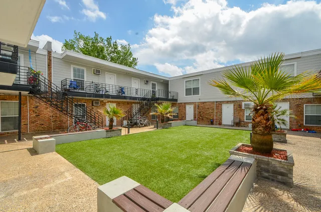 a front view of house with yard and patio