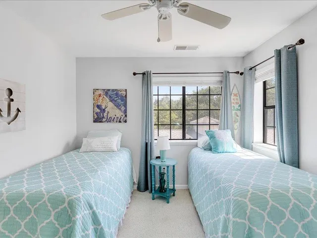 a bedroom with double bed and a window