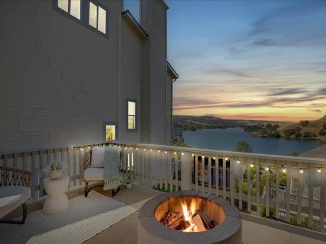 a view of a balcony with furniture