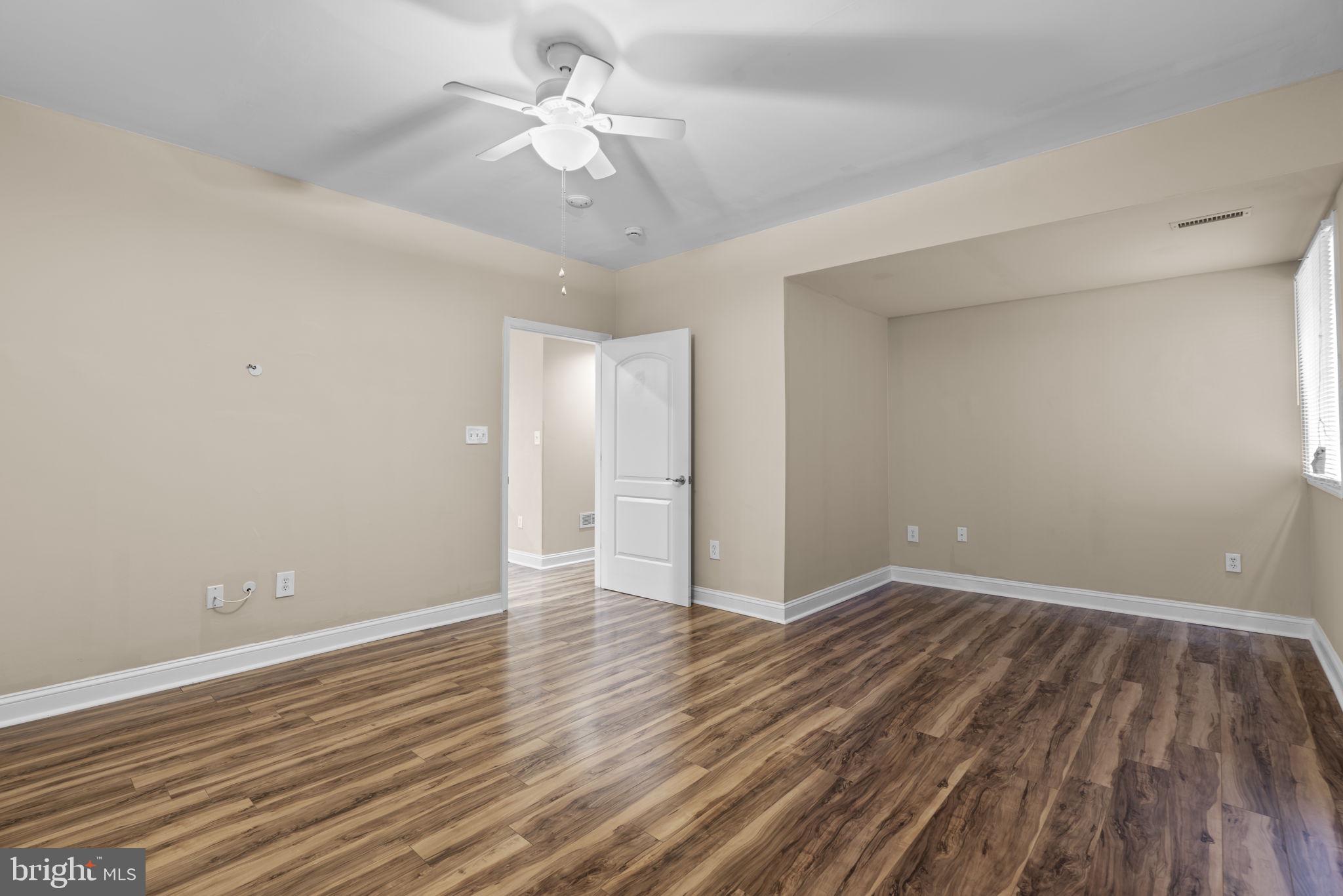 8024 Solley Road Glen Burnie, MD 21060 - Photo 65 of 83 a view of an empty room with wooden floor
