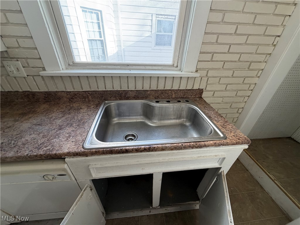 1020 West Prospect Road Ashtabula, OH 44004 - Photo 12 of 22 Kitchen view of dark countertops and a sink