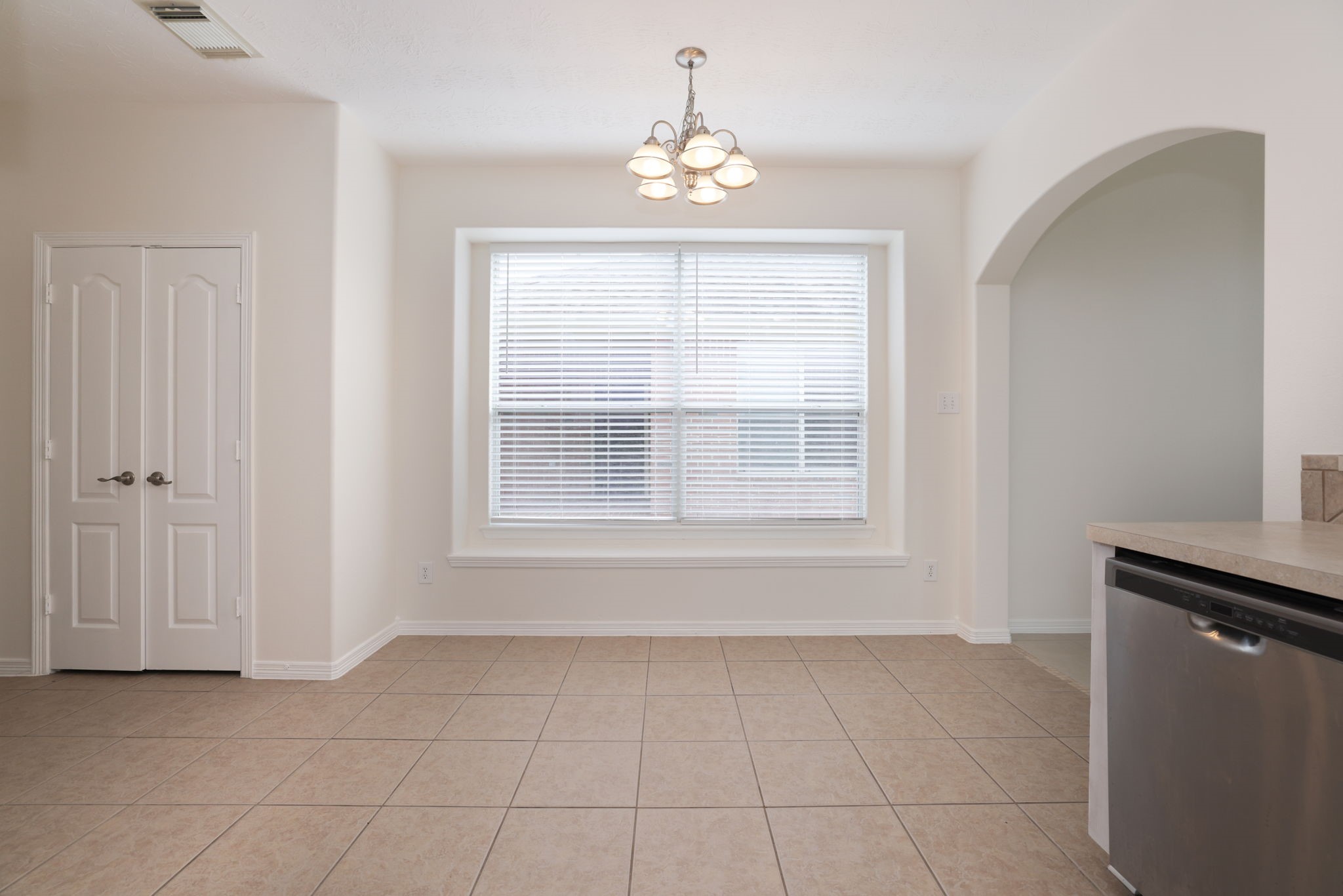 3031 Country Boy Court Spring, TX 77373 - Photo 14 of 35 an empty room with windows and entrance