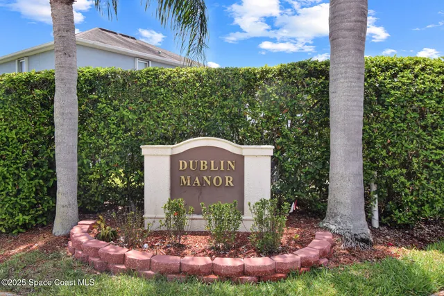 a view of a park that has a sign board