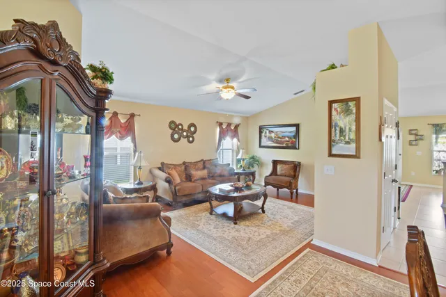 a living room with furniture and a rug