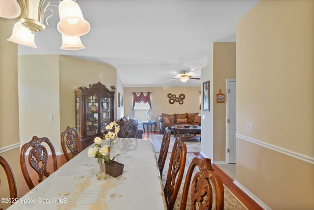 a view of a livingroom with furniture and a chandelier