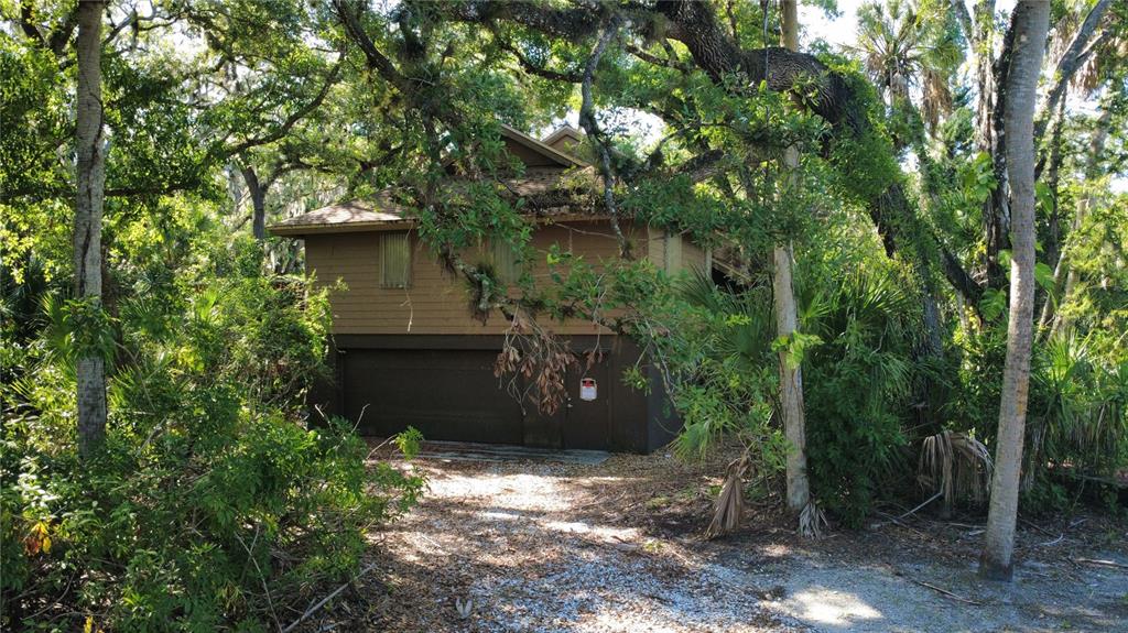 4632 Stone Ridge Trail Sarasota, FL 34232 - Photo 14 of 15 a front view of a house with a tree