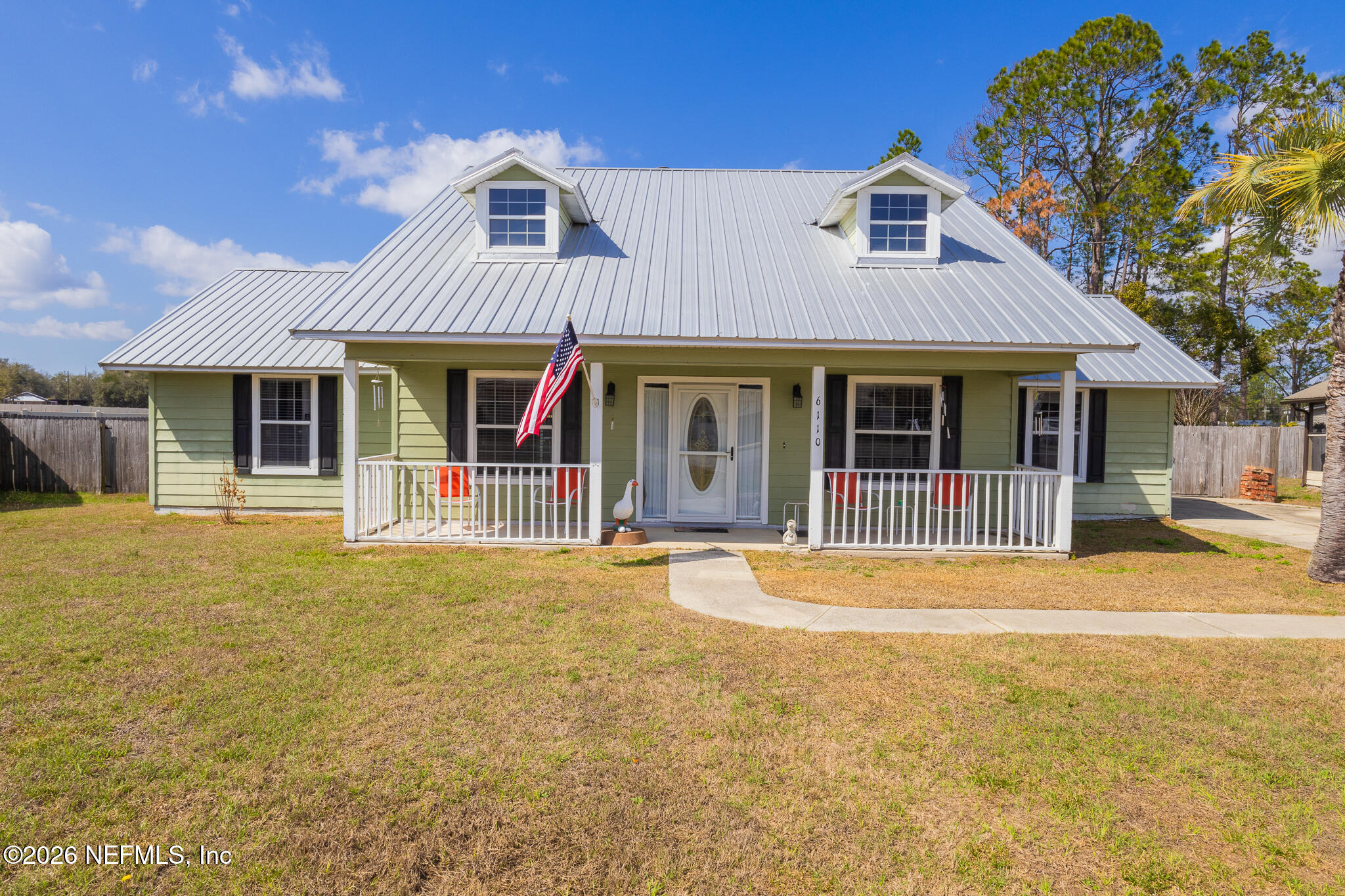 6110 4th Manor West Palatka, FL 32177 - Photo 1 of 44 a front view of a house with a garden