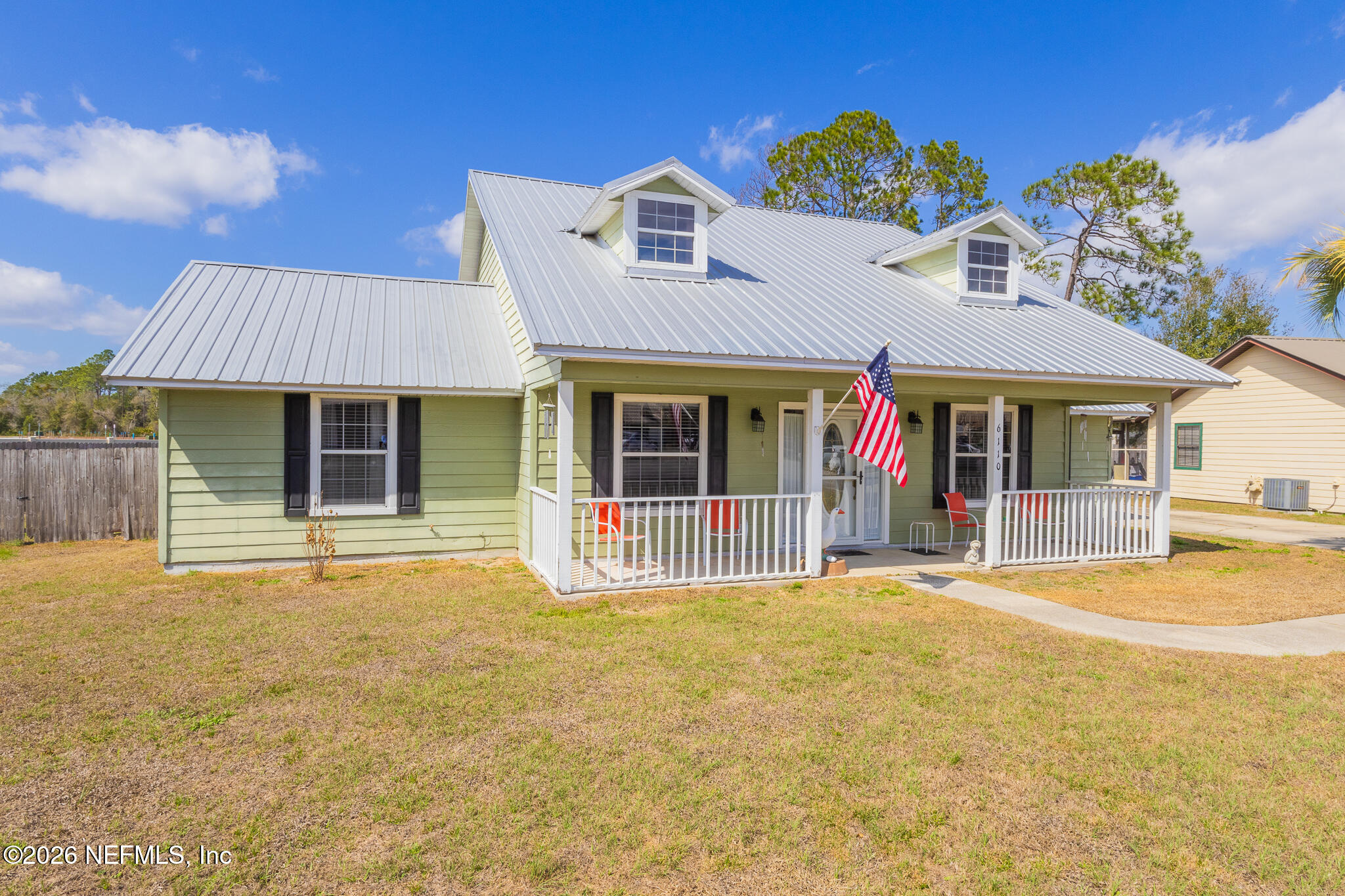 6110 4th Manor West Palatka, FL 32177 - Photo 2 of 44 a front view of a house with a garden