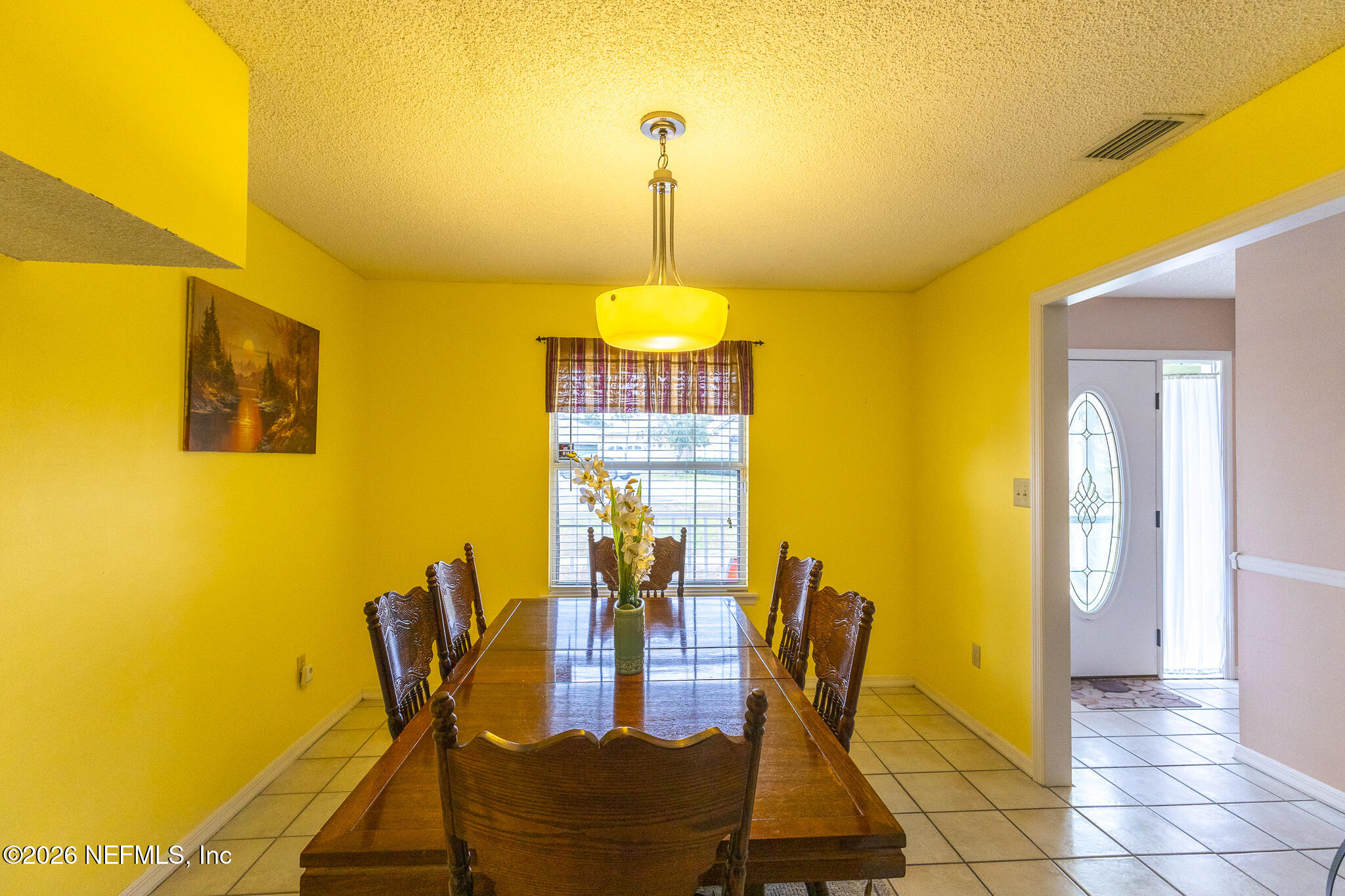6110 4th Manor West Palatka, FL 32177 - Photo 27 of 44 a view of a dining room with furniture and chandelier