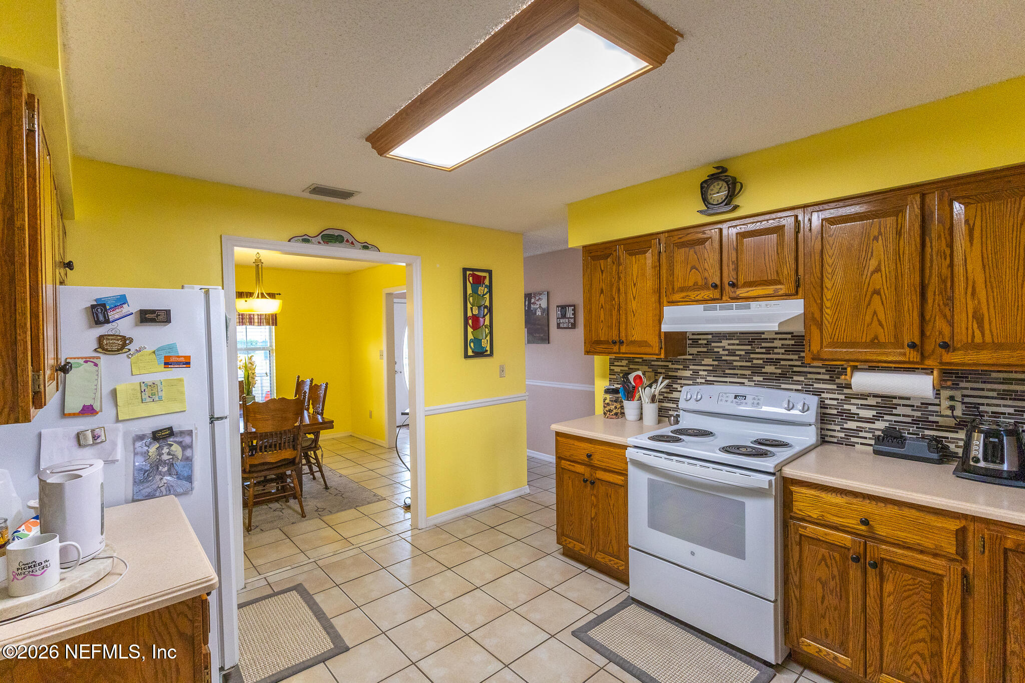 6110 4th Manor West Palatka, FL 32177 - Photo 29 of 44 a kitchen with stainless steel appliances a sink and cabinets