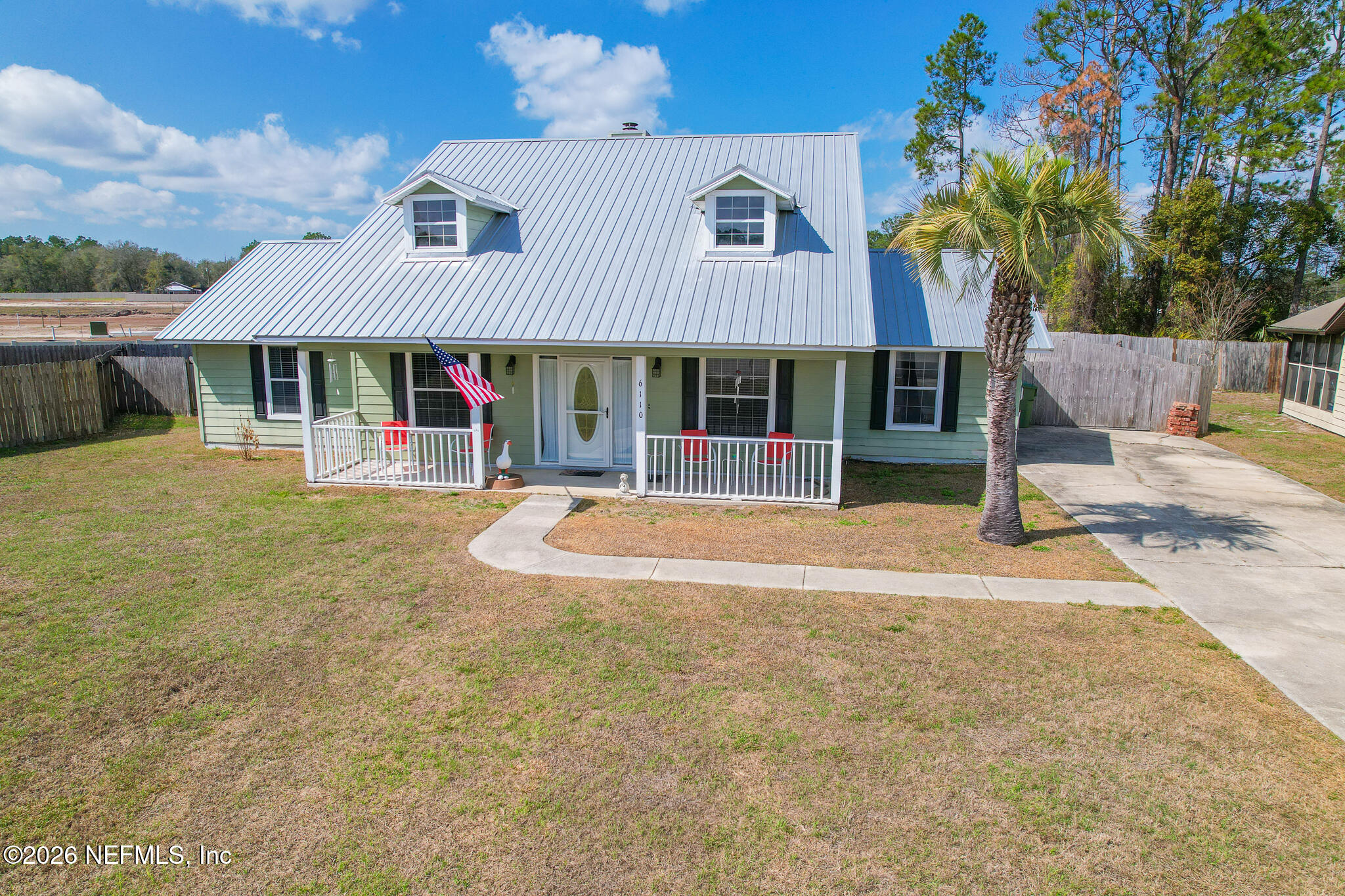 6110 4th Manor West Palatka, FL 32177 - Photo 3 of 44 a view of a house with backyard and porch