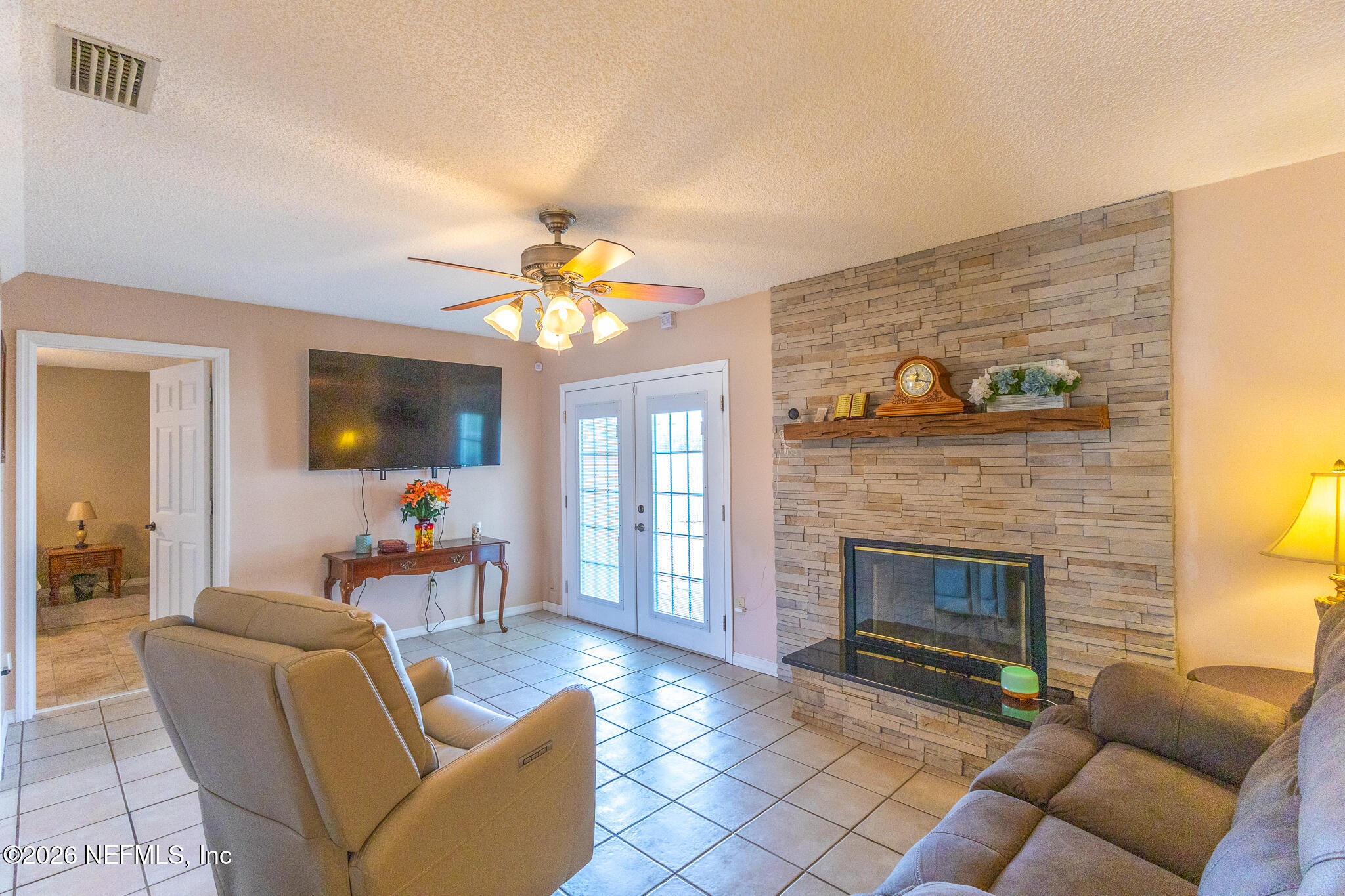 6110 4th Manor West Palatka, FL 32177 - Photo 35 of 44 a living room with furniture and a fireplace