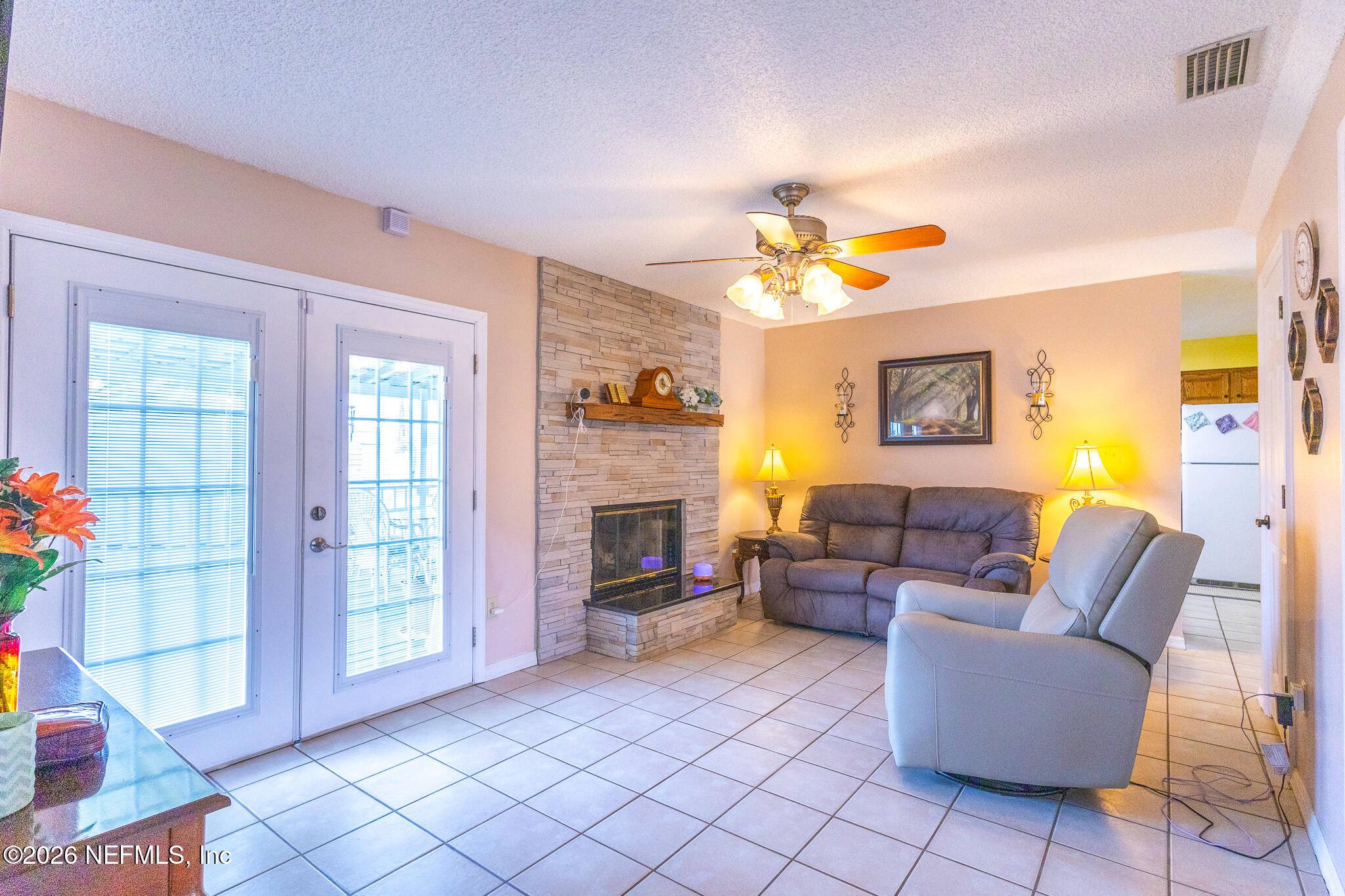 6110 4th Manor West Palatka, FL 32177 - Photo 36 of 44 a living room with furniture and a fireplace