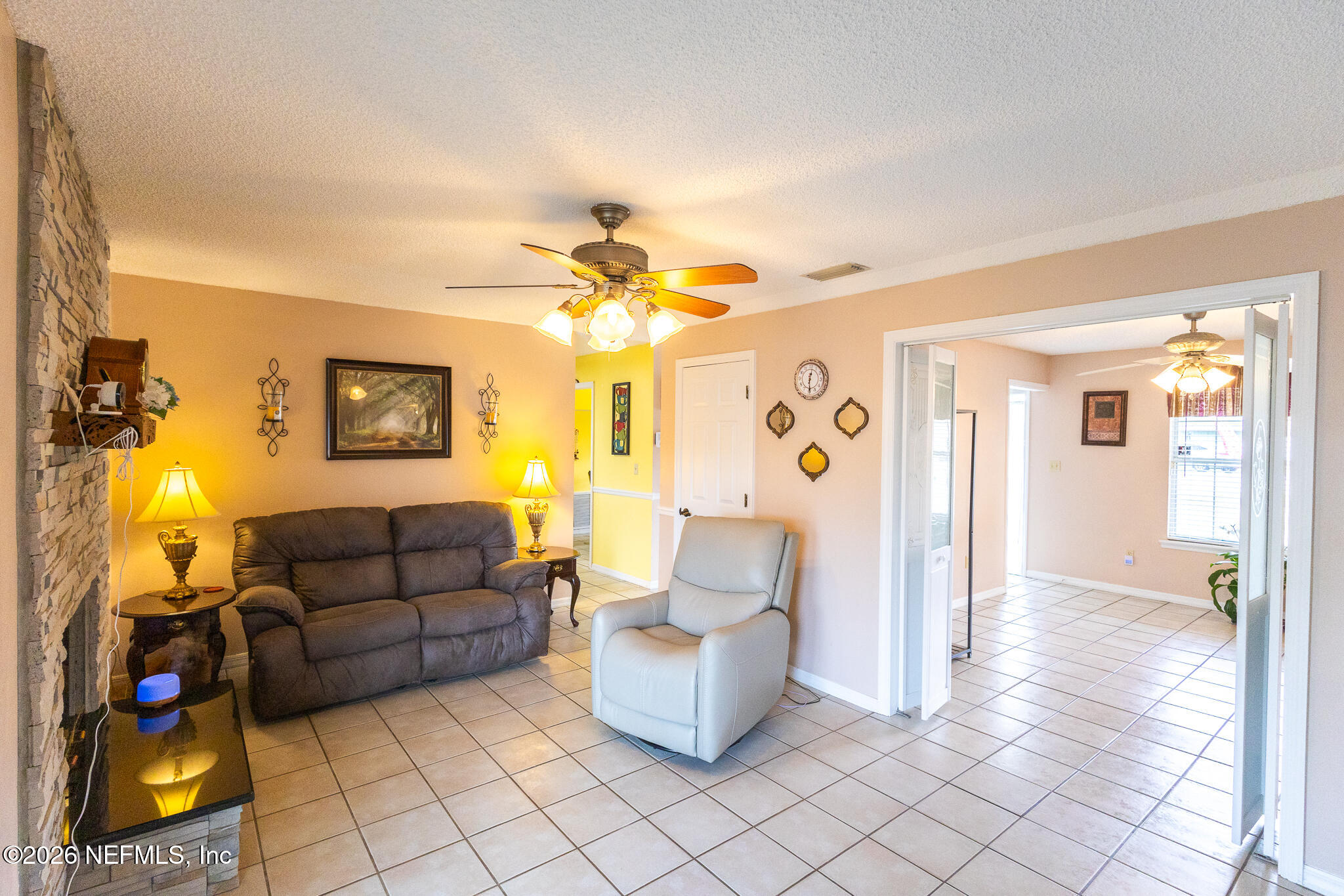 6110 4th Manor West Palatka, FL 32177 - Photo 37 of 44 a living room with furniture and a lamp