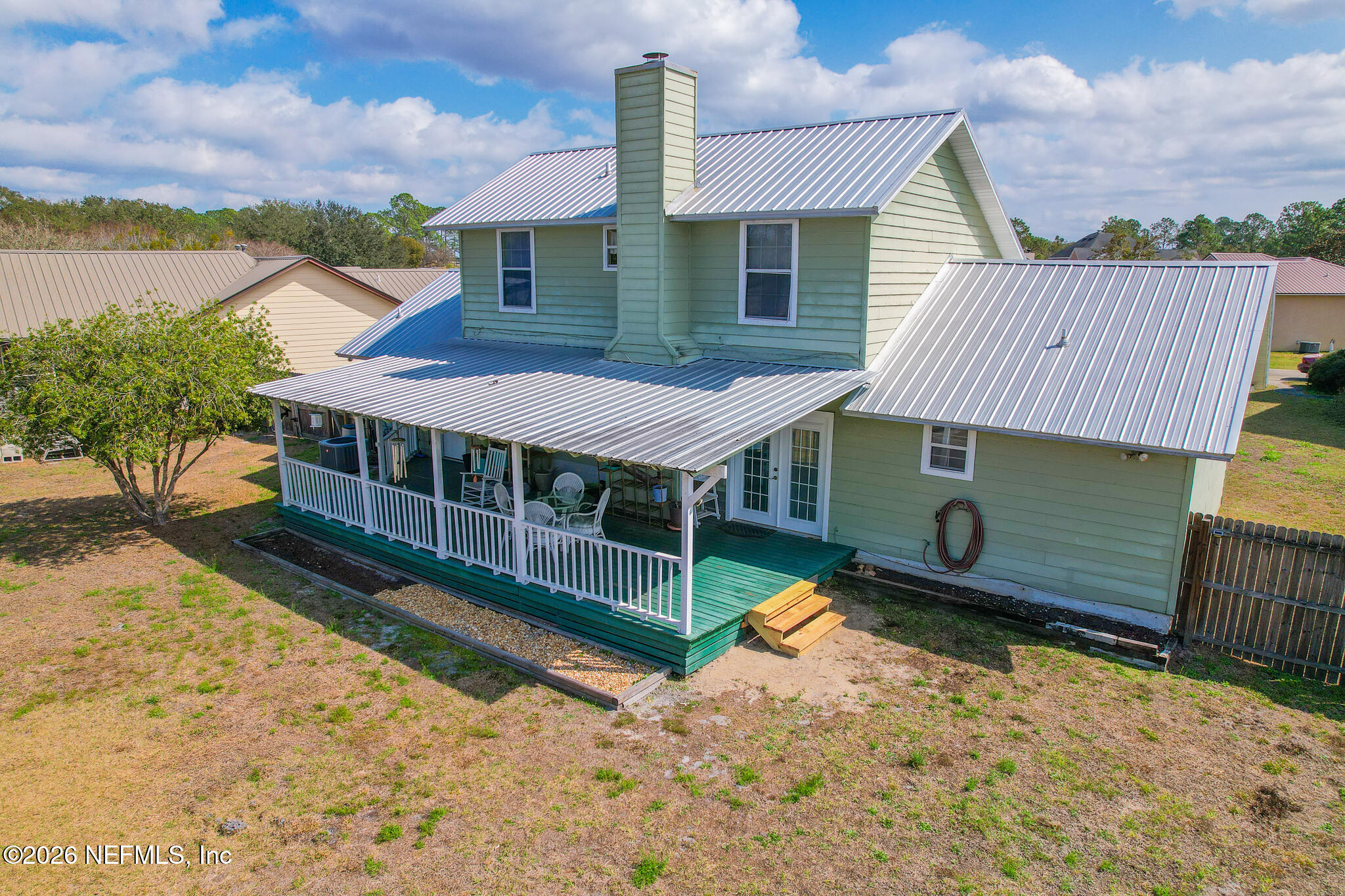 6110 4th Manor West Palatka, FL 32177 - Photo 5 of 44 a view of a house with wooden fence