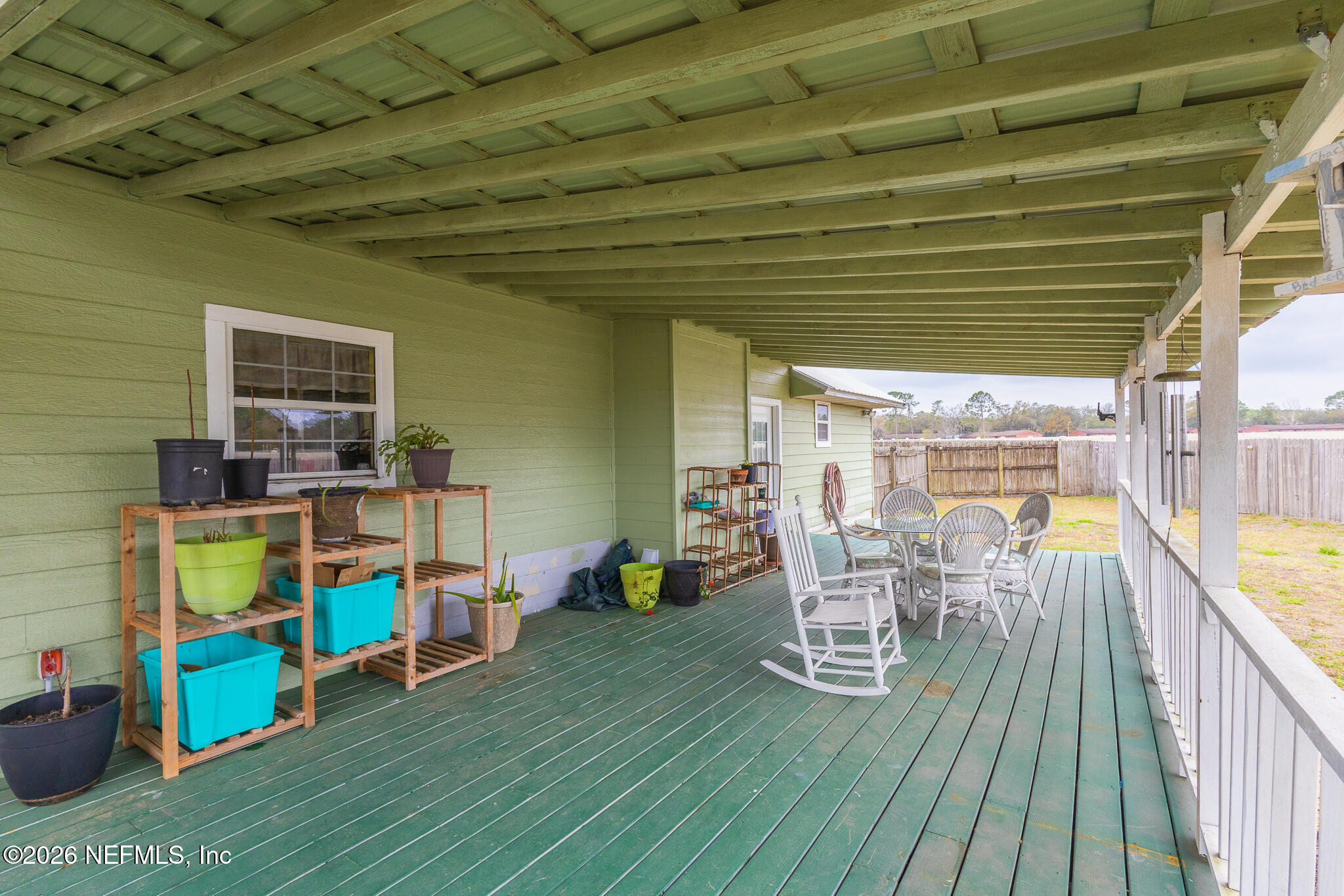 6110 4th Manor West Palatka, FL 32177 - Photo 8 of 44 a view of a chairs and table in a patio