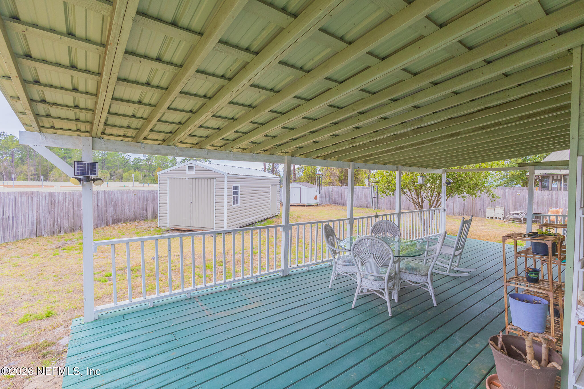 6110 4th Manor West Palatka, FL 32177 - Photo 9 of 44 a view of a roof deck with wooden floor