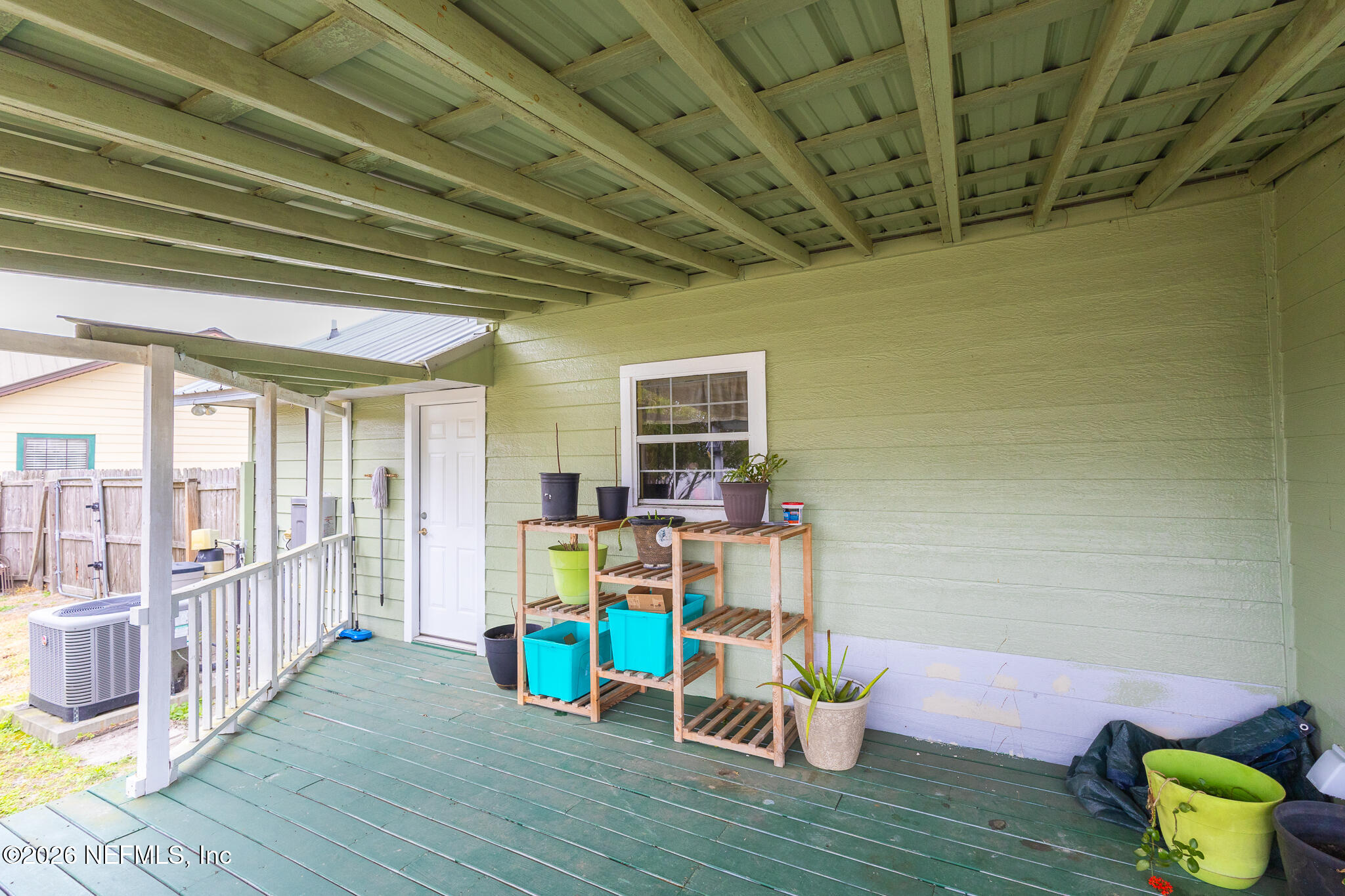 6110 4th Manor West Palatka, FL 32177 - Photo 10 of 44 a living room with furniture and a wooden floor
