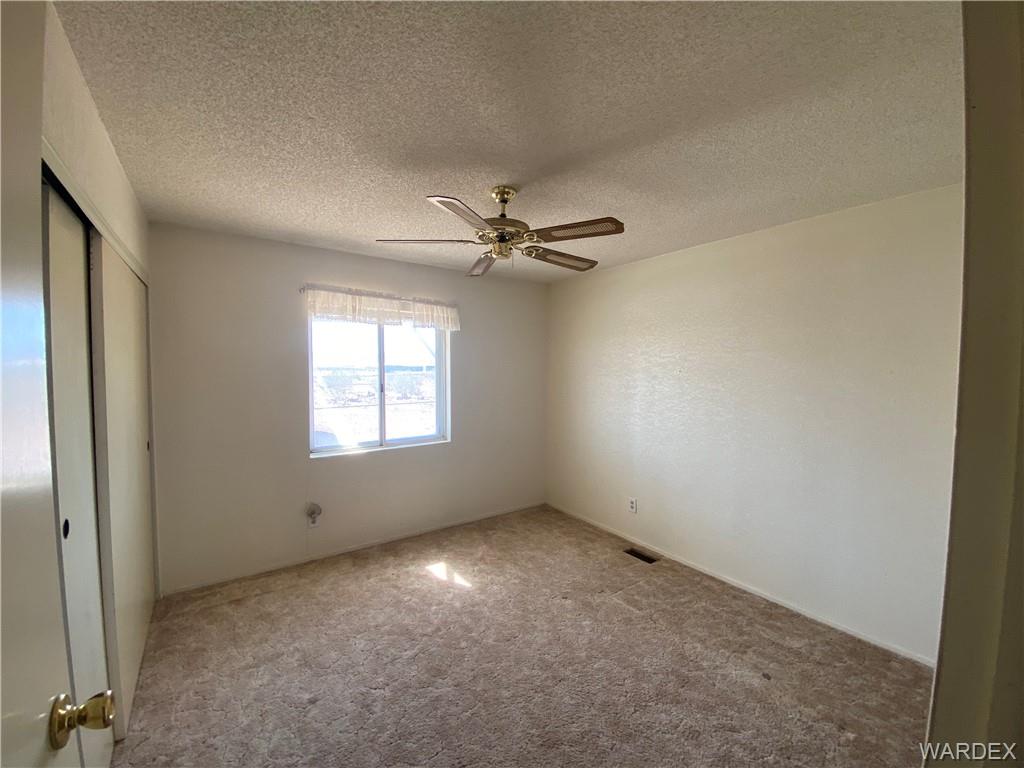4649 Eden Road Golden Valley, AZ 86413 - Photo 16 of 26 a view of an empty room with a window