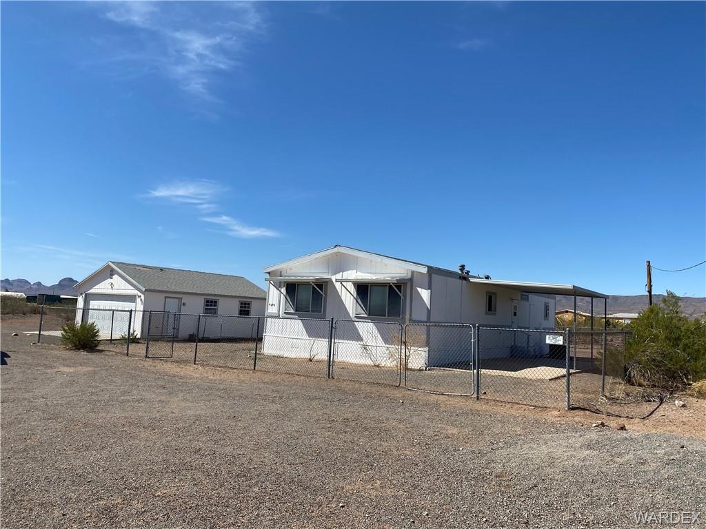 4649 Eden Road Golden Valley, AZ 86413 - Photo 17 of 26 a view of a house with a backyard