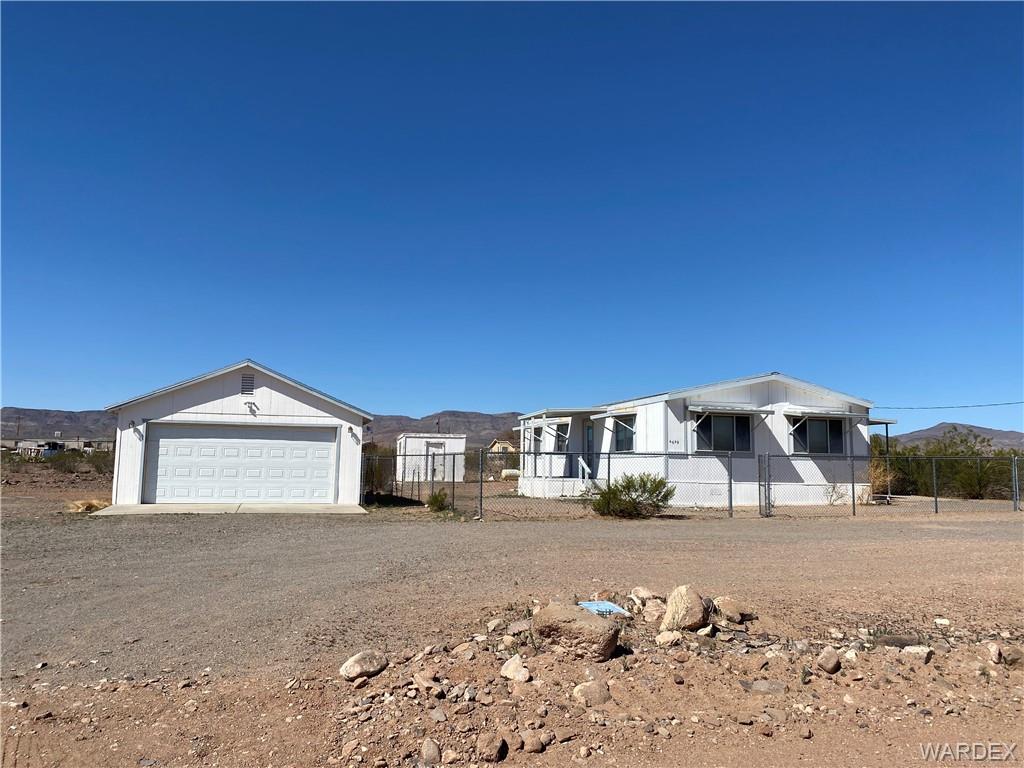 4649 Eden Road Golden Valley, AZ 86413 - Photo 24 of 26 a front view of a house with a yard