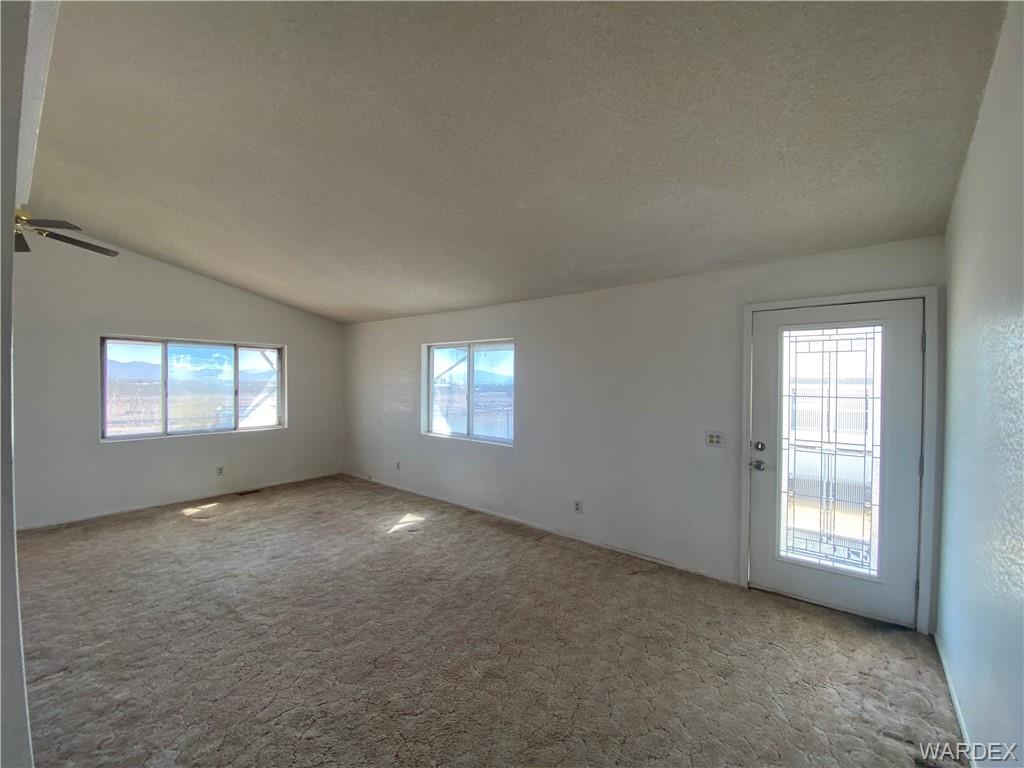 4649 Eden Road Golden Valley, AZ 86413 - Photo 5 of 26 an empty room with windows