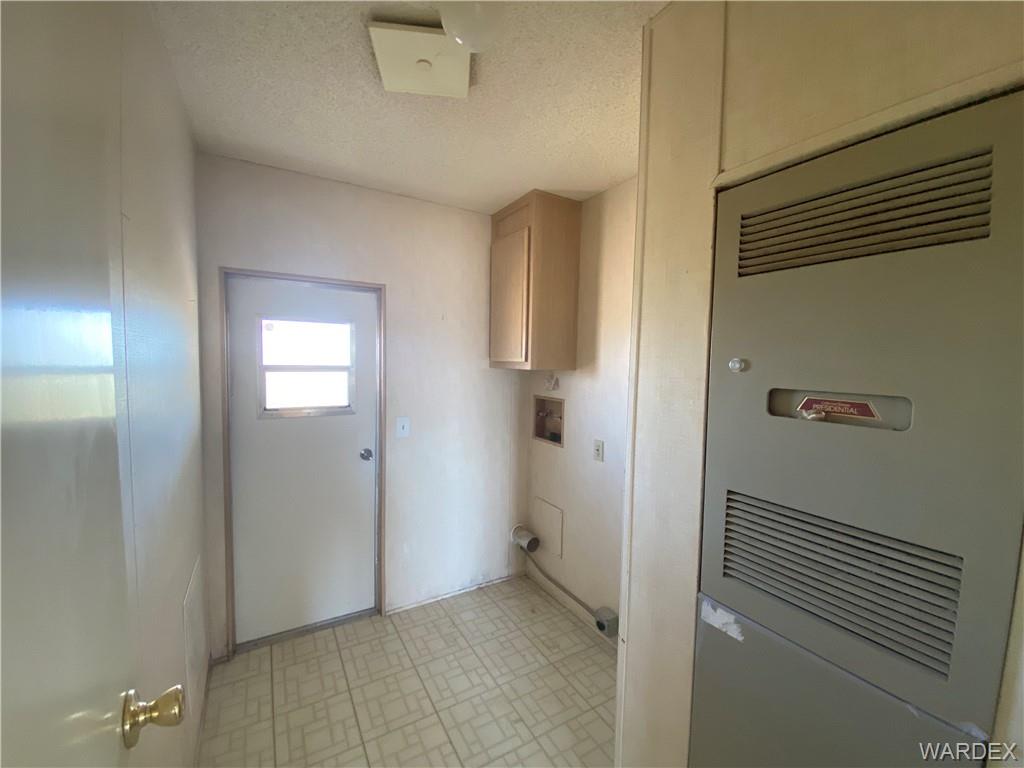 4649 Eden Road Golden Valley, AZ 86413 - Photo 10 of 26 a view of a livingroom with wooden floor and closet