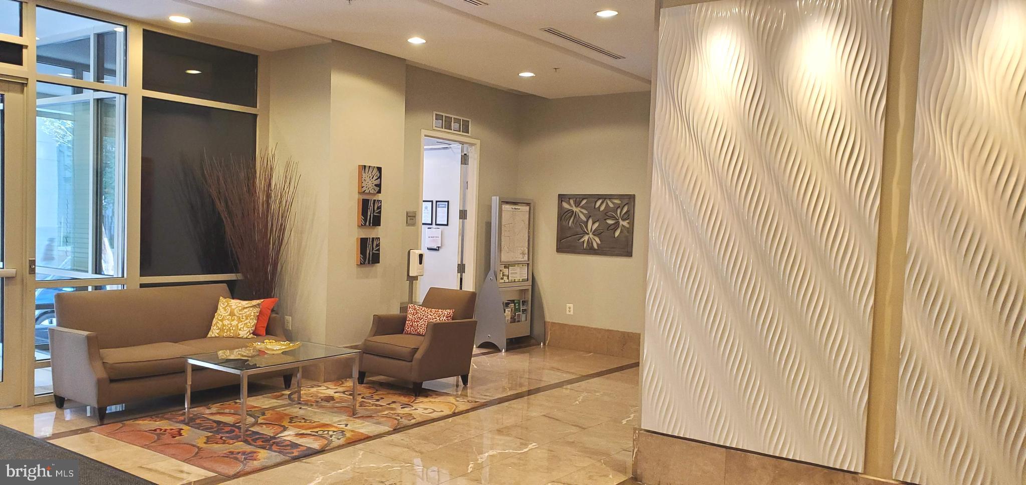 820 North Pollard Street, Unit 810 Arlington, VA 22203 - Photo 41 of 49 a living room with furniture and a window