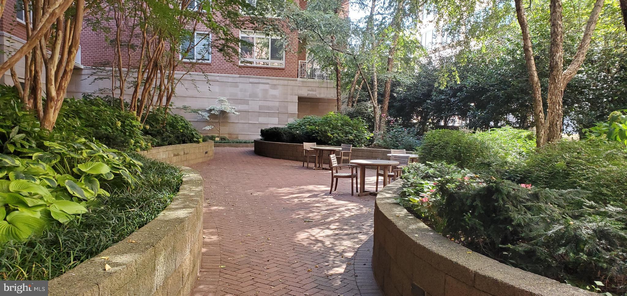 820 North Pollard Street, Unit 810 Arlington, VA 22203 - Photo 43 of 49 a view of a chairs and table in the backyard of the house