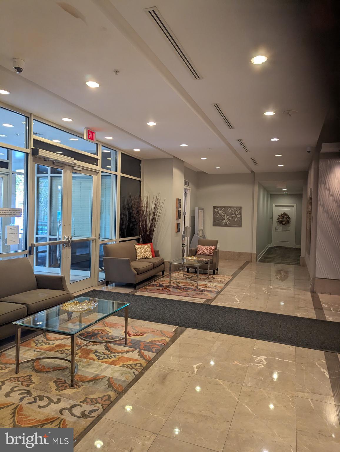 820 North Pollard Street, Unit 810 Arlington, VA 22203 - Photo 48 of 49 a lobby with furniture and a potted plant