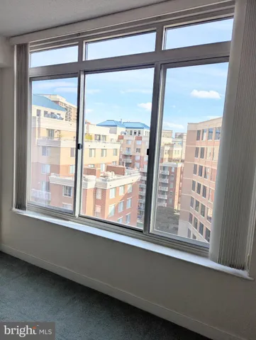 a kitchen with granite countertop a sink and a large window