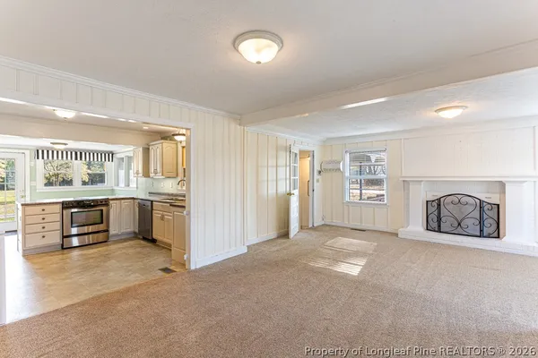 a view of a kitchen with furniture and a window
