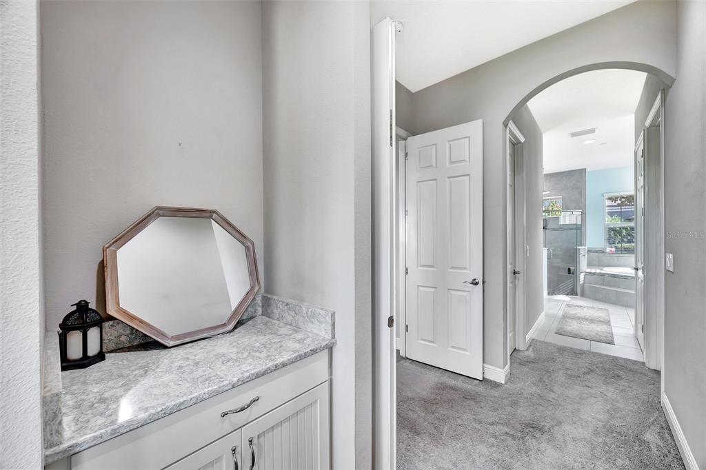 6324 Brevada Lane Apollo Beach, FL 33572 - Photo 24 of 53 a view of a mirror and cabinets