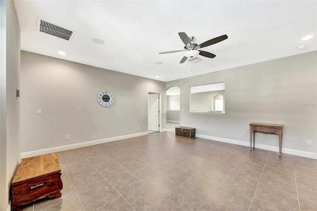 6324 Brevada Lane Apollo Beach, FL 33572 - Photo 37 of 53 an empty room with windows and fan