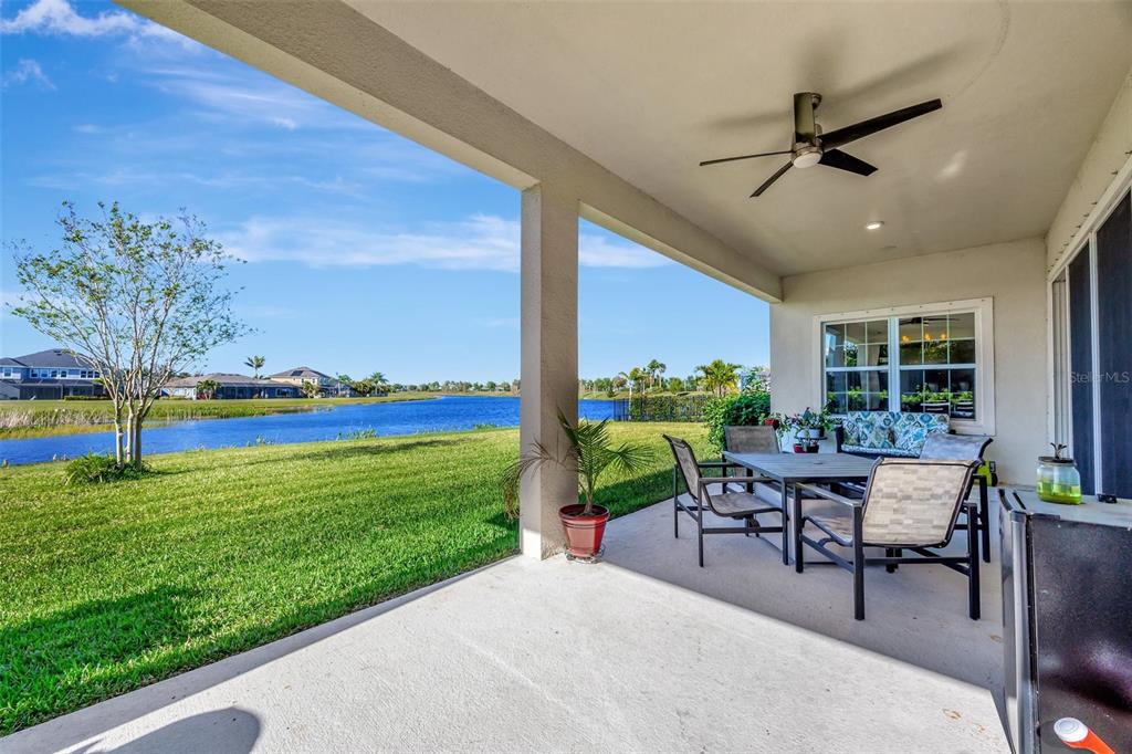 6324 Brevada Lane Apollo Beach, FL 33572 - Photo 39 of 45 a view of a patio with a table and chairs