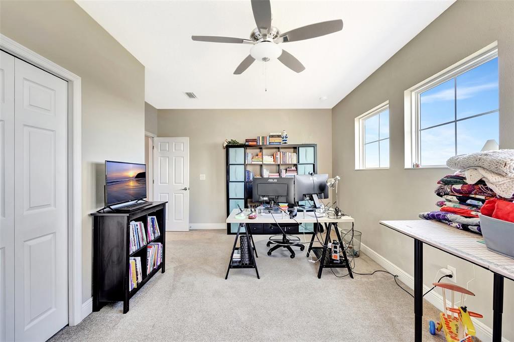 6324 Brevada Lane Apollo Beach, FL 33572 - Photo 39 of 53 a view of a workspace with furniture and a window