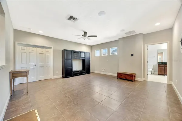 a view of a patio with a table and chairs