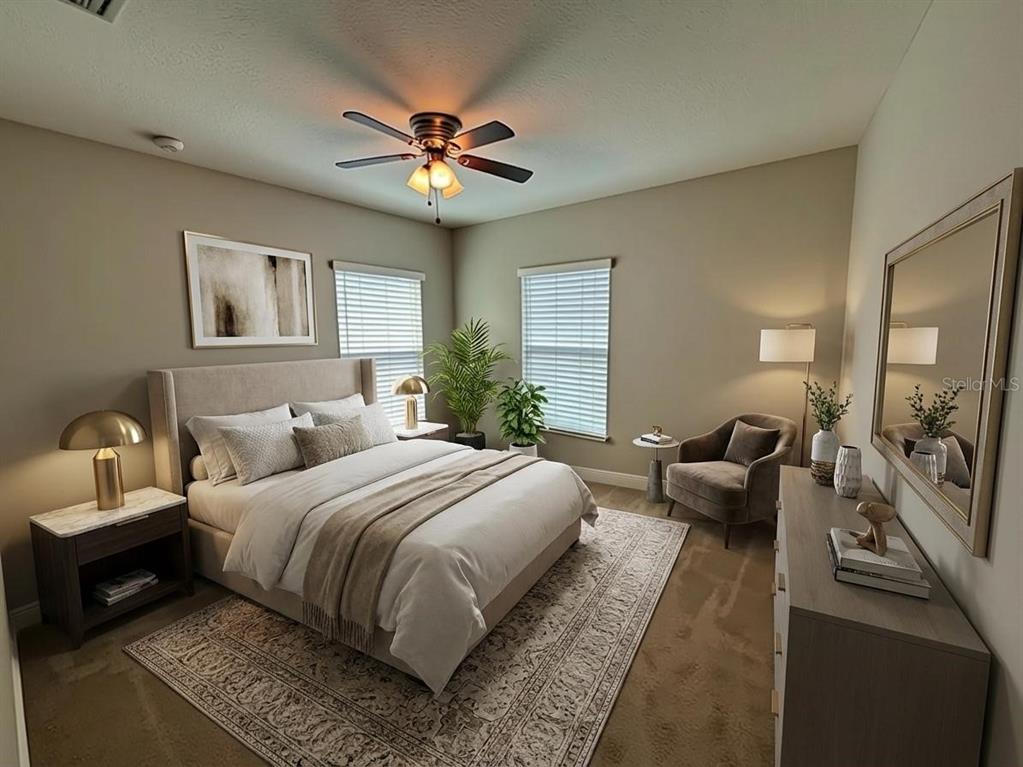 6324 Brevada Lane Apollo Beach, FL 33572 - Photo 9 of 45 a bedroom with a large bed couch and a window