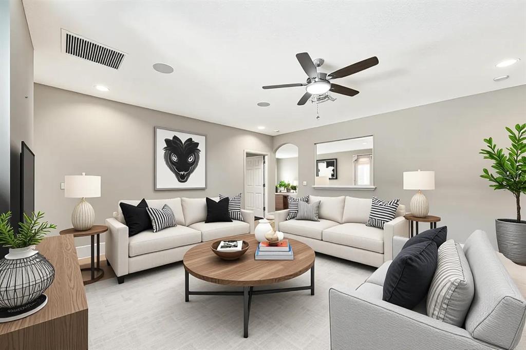 6324 Brevada Lane Apollo Beach, FL 33572 - Photo 10 of 45 a living room with furniture and a large window