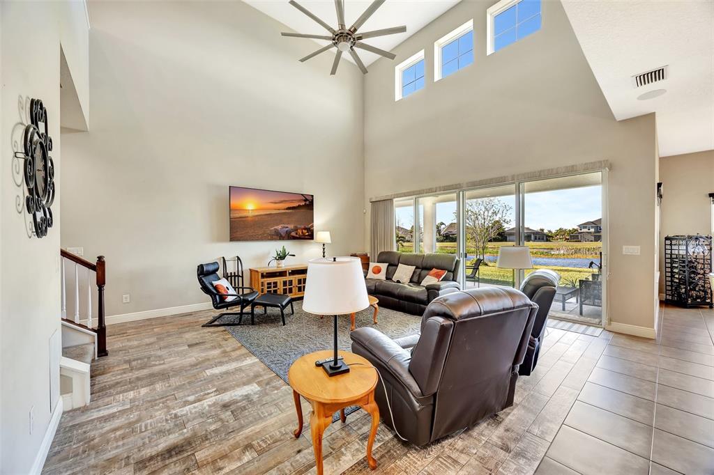 6324 Brevada Lane Apollo Beach, FL 33572 - Photo 10 of 53 a living room with furniture and a flat screen tv
