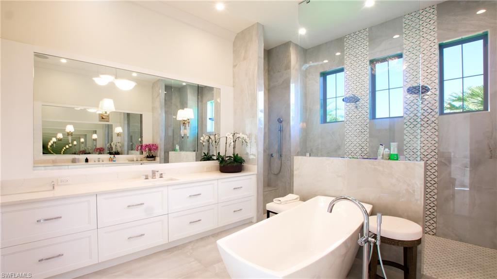 700 Wedge Drive Naples, FL 34103 - Photo 19 of 19 a bathroom with a double vanity sink mirror and toilet