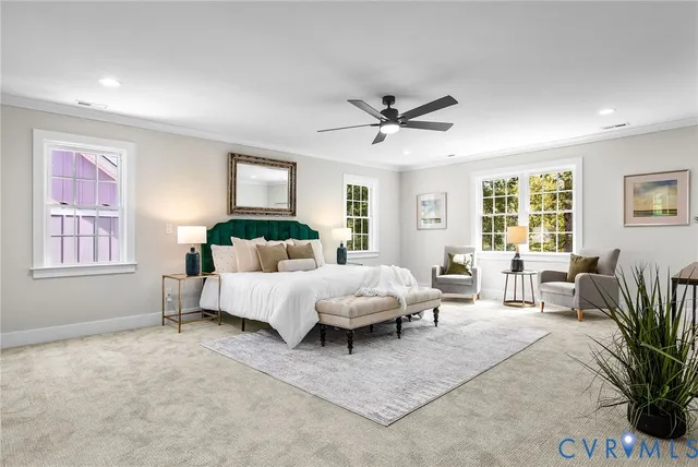 a living room with furniture and windows