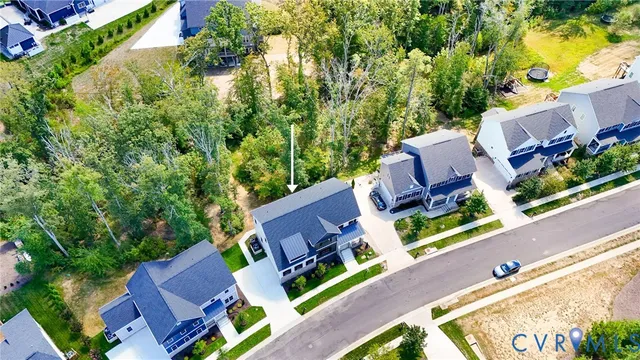 an aerial view of house with yard swimming pool and outdoor seating