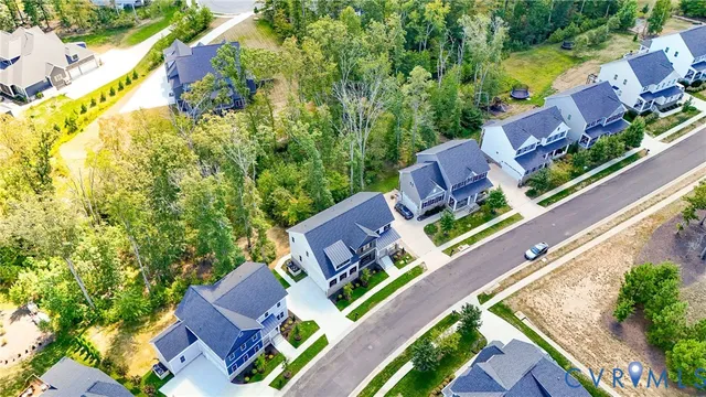 an aerial view of a house with a garden