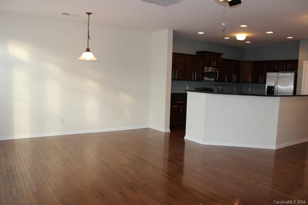 409 Armour Street Davidson, NC 28036 - Photo 7 of 24 a view of kitchen with refrigerator and microwave