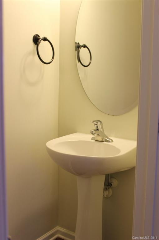 409 Armour Street Davidson, NC 28036 - Photo 9 of 24 a bathroom with a sink and mirror