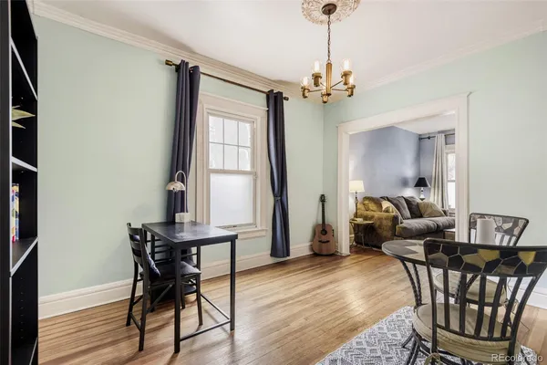 a view of a dining room with furniture window and wooden floor