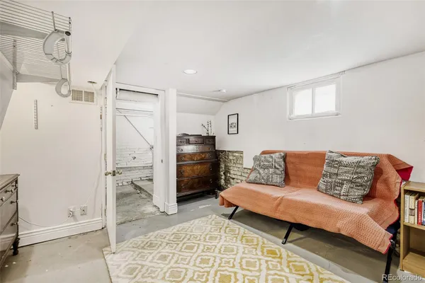 a living room with furniture and a rug
