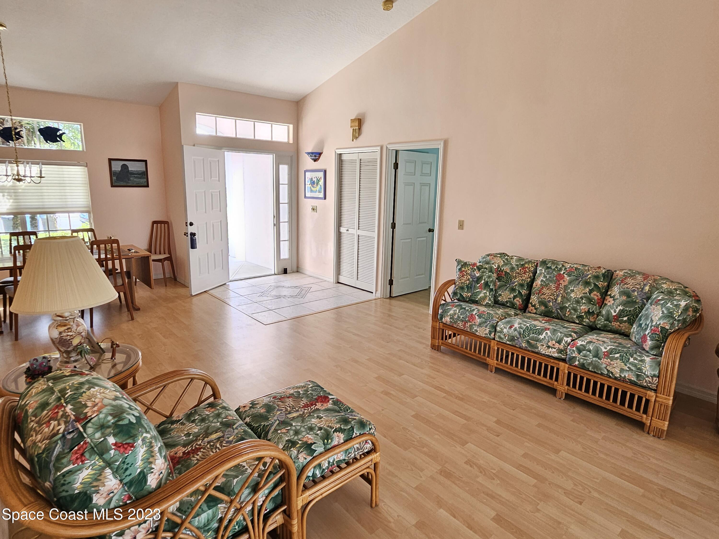 1910 Glen Meadows Circle Melbourne, FL 32935 - Photo 22 of 28 a living room with furniture and a couch